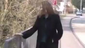 Corporate woman urinating on the roadway