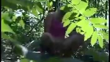 Jana urinating in the forest
