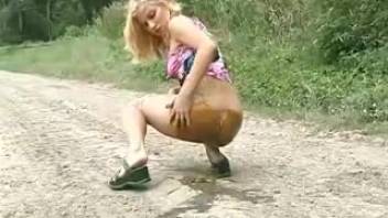 Young woman defecating on the street 2