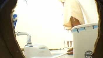 Youthful Asian girl defecating post-enema